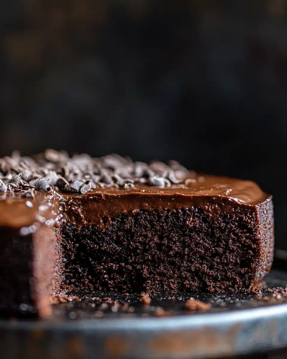 Deliciously rich Chocolate Brownie Cake topped with chocolate drizzle